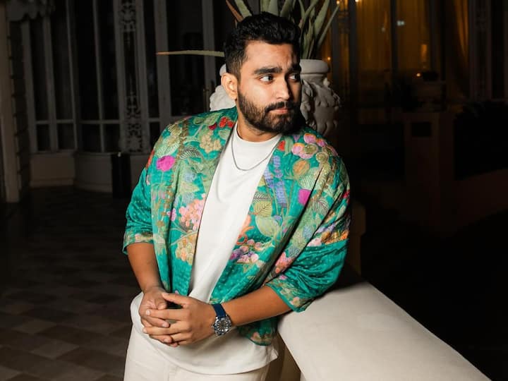 He embraced a cool vibe with a floral-printed green jacket by Yuva, paired stylishly with white pants by Freakins India and a white t-shirt. (Image source: Instagram/ viraj_ghelani)