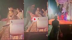 स्टेज पर बैठे दूल्हे पर दुल्हन के सामने शख्स ने बरसाए कई घूसे, शादी में कलेश का वीडियो हो रहा वायरल