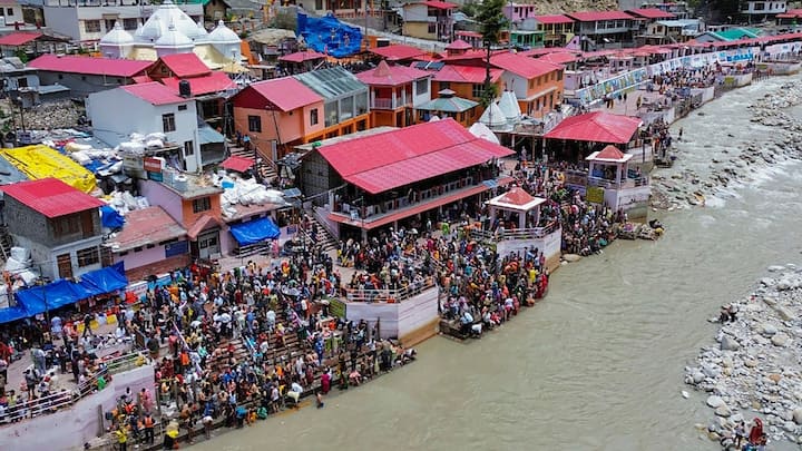 Devotees take a dip in the Ganga after the Gangotri temple opened its doors for the Char Dham Yatra | Photo: PTI
