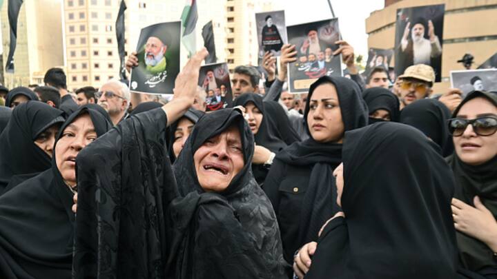 Women mourn Iranian president Raisi in Tehran. Iran’s supreme leader, Ayatollah Khamenei, announced a five-day public mourning period on Monday. (Photo: Getty)