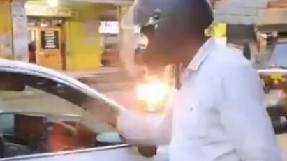 UP man fined Rs 1,000 for driving Audi without helmet AUDI காரில் ஹெல்மெட் அணிந்து செல்லும் நபர்! வைரலாகும் வீடியோ - காரணம் என்ன?