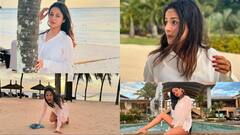 Shehnaaz Gill Pics: व्हाइट टॉप और डेनिम शॉर्ट्स पहन बीच पर इठलाती दिखीं शहनाज गिल, तस्वीरें देख फैंस बोलें - ‘गॉर्जियस सना’