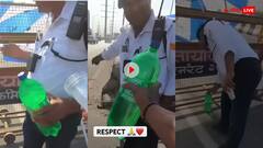 भीषण ​​गर्मी​ में ड्यूटी कर रहे पुलिस वालों को शख्स ने बांटी कॉल्ड ड्रिंक...वायरल हो रहा वीडियो
