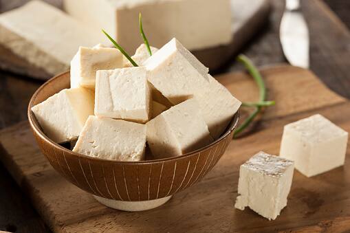 Tofu: Plant-based tofu is a highly adaptable source of protein, with around 10 grams of protein per half-cup meal. For an additional protein boost, it may be incorporated into smoothies, stir-fried, or added to soups. (Image Source: Getty)