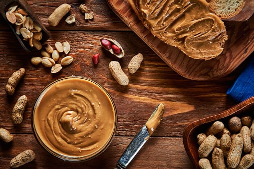 Nuts and Nut Butter: Nuts high in protein include peanuts and almonds, as well as the butters made from them. A serving of peanut butter has around 7 grams of protein. Spread it over whole-grain bread or dip apple slices into it. (Image Source: Getty)
