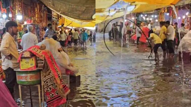 Nashik Rain Update Heavy rain at Saptshrungi gad water entered in shops Maharashtra Marathi News Nashik Rain : सप्तशृंगी गडावर जोरदार पावसाची हजेरी, भाविकांची एकच धावपळ, दुकानांमध्येही शिरलं पाणी