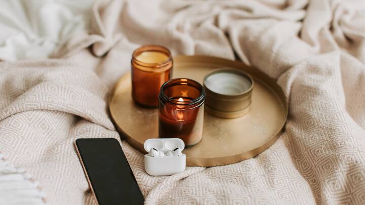 5. Bedroom Serenity: Create a tranquil sanctuary in your bedroom by placing candles on nightstands or dressers. Soft, relaxing scents like chamomile or vanilla can promote restful sleep. Be sure to use candle holders to prevent any potential hazards and keep flames away from flammable materials. (Image Source: Canva)