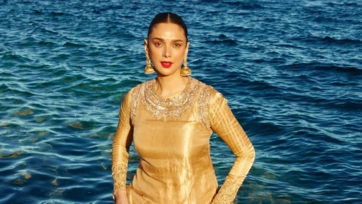 Aditi Rao Hydari wowed at Cannes in an exquisite golden ethnic ensemble designed by Manish Malhotra.