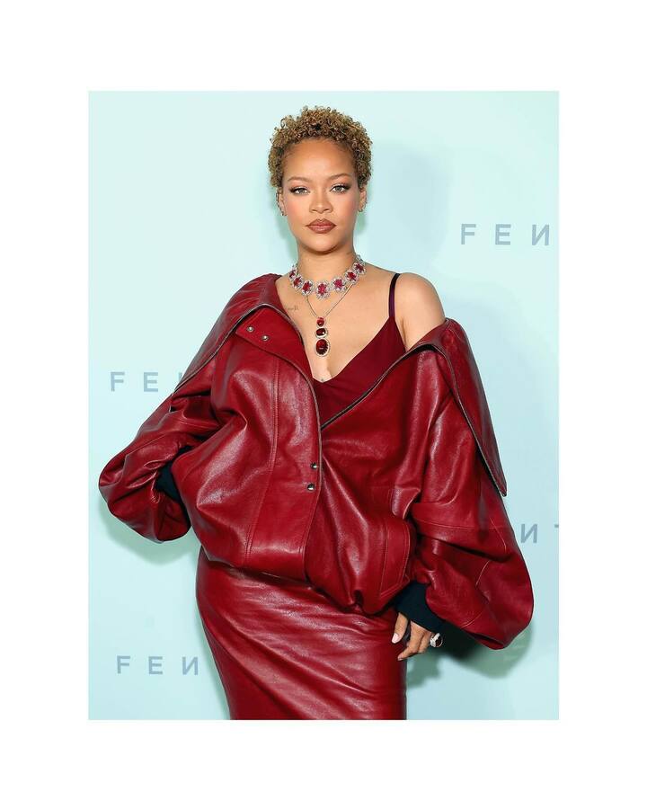 Rihanna donned an oversized zipper jacket, skirt, and camisole in the shade of ruby.