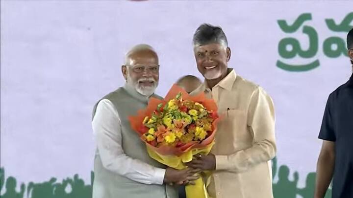 Prime Minister Narendra Modi greets N. Chandrababu Naidu after the TDP leader took oath as Andhra Pradesh CM. (Photo: YouTube/Narendra Modi)