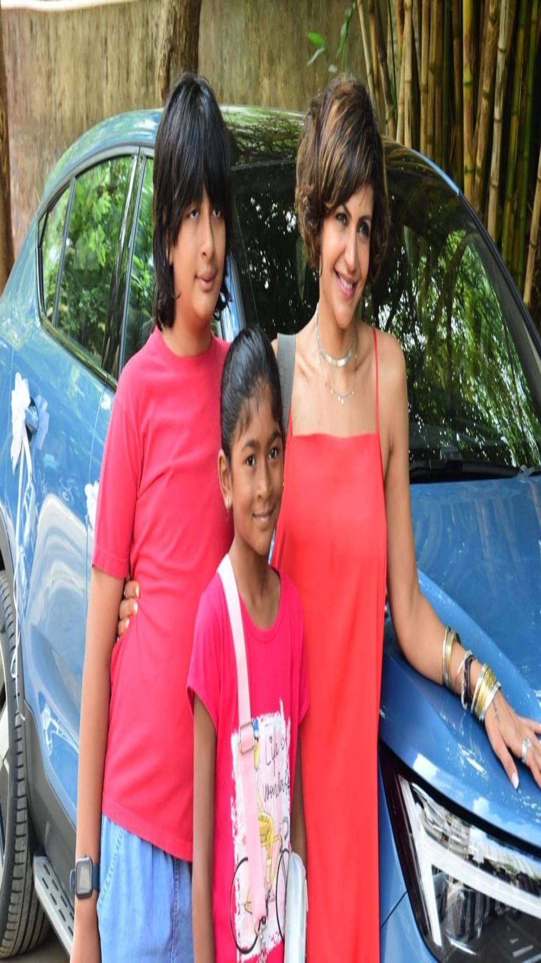Mandira posed for the paps with the new car