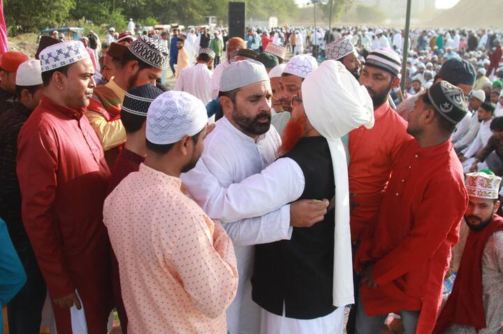 Muslims greet each other after offering prayers on the occasion of Eid al-Adha festival, in Gurugram.(Image source: PTI)