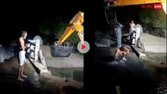 शख्स ने लगाया गजब का जुगाड़...जेसीबी से नहाते हुए शख्स का वायरल वीडियो देखा क्या?