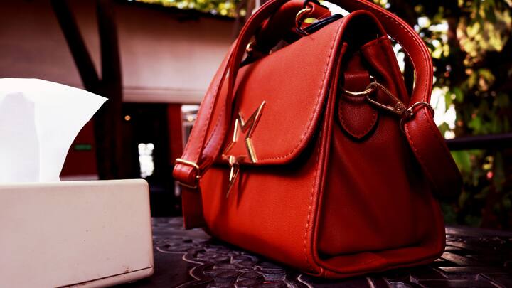 Accessorize with Intention Your handbag is one item that can boost any ensemble with the proper accessories. For a hint of femininity, wear a beautiful chain necklace with your vegan tote. A large scarf knotted around a satchel's handle lends an air of effortless style. (Image source: Canva)