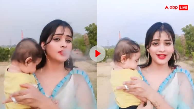 woman smoked with an innocent child in her lap users got angry video goes viral Viral Video: शर्मनाक! बच्चे को गोद में लेकर सिगरेट पीती दिखी महिला, यूजर्स बोले- शर्म है तुम्हारे मां होने पर