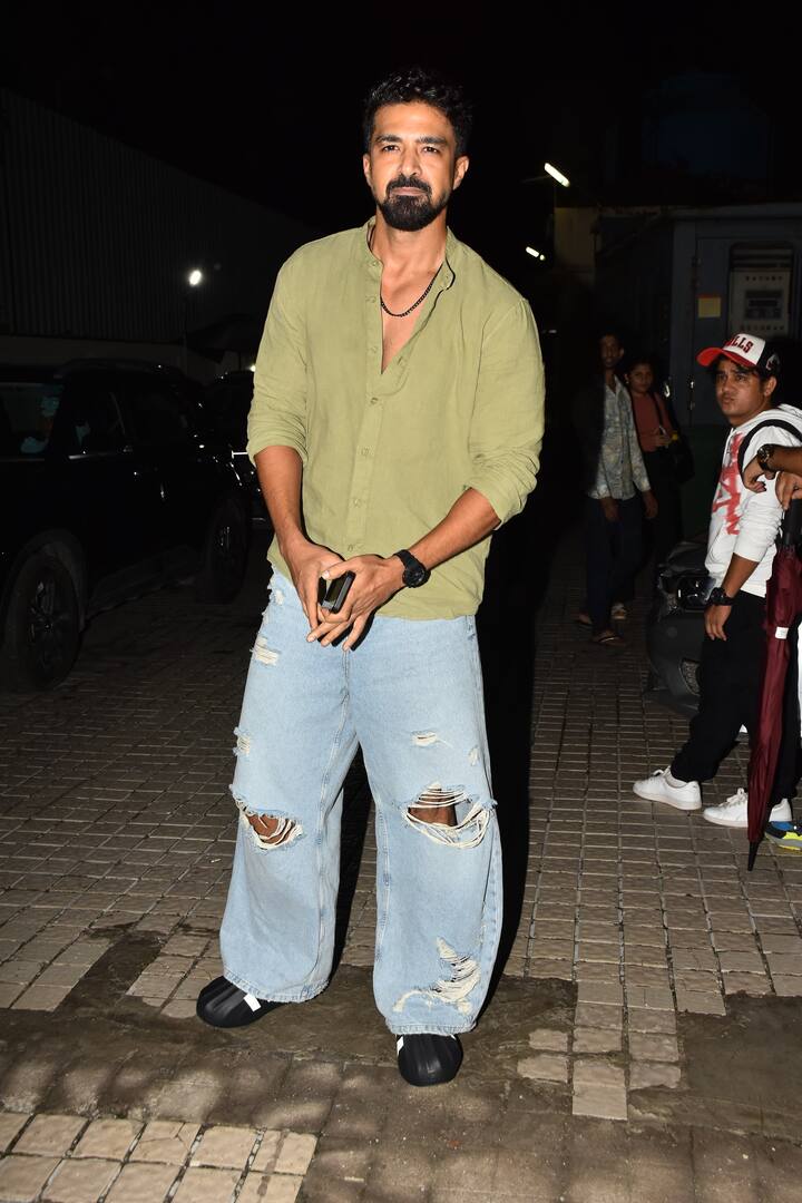 Saqib Saleem poses for the paparazzi as he arrives for the screening.