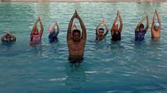 Photos: योग दिवस से पहले कोटा में जल योग का प्रशिक्षण, पानी के अंदर लोगों ने किए आसन, देखिए तस्वीरें