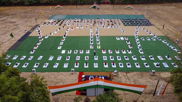 Indian Army personnel perform yoga on the 10th International Day of Yoga, on Friday in New Delhi.