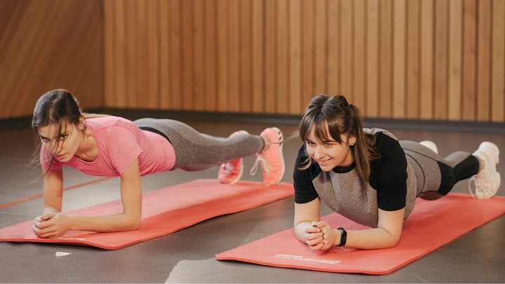 4. Plank Pose (Phalakasana): This pose strengthens the core and tones the arms, legs, shoulders, and abdominals. This helps in increasing physical strength, it develops mental toughness and endurance, which lowers stress. (Image source: Canva)