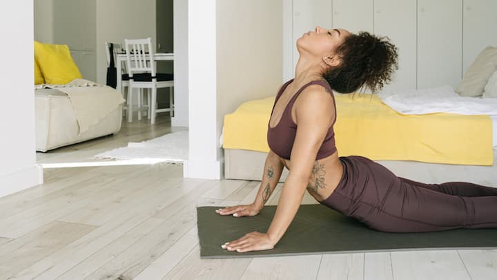 2. Bhujangasana or Cobra Pose:  Bhujangasana is beneficial for the spine and can help relieve lower back pain. It is crucial to lift only slightly and keep the navel on the ground to avoid excessive pressure on the back. (Image source: Canva)