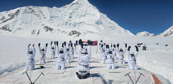 Indian Army personnel perform yoga amid the cold and snow.