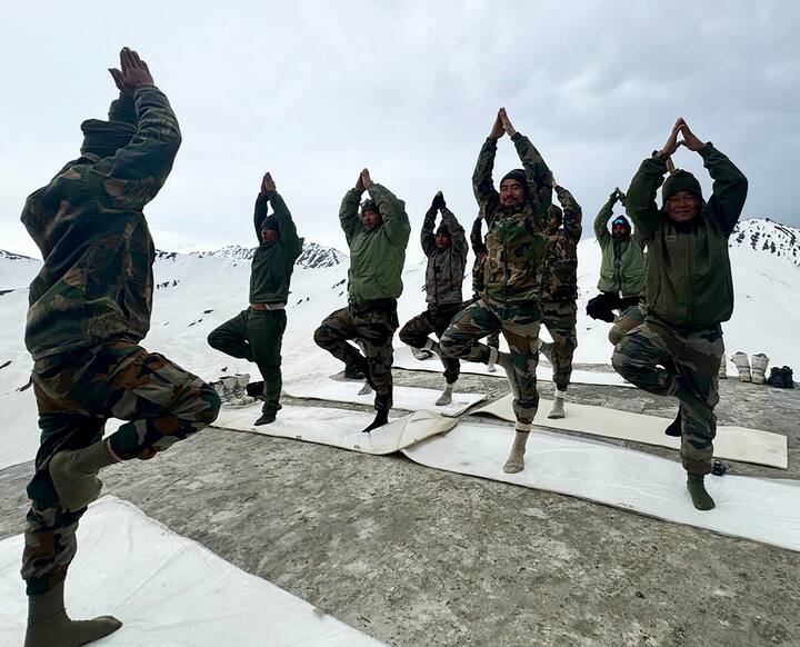 Indian Army personnel perform yoga on the 10th International Day of Yoga, near the Line of Control in Gurez Valley, in Bandipora, Jammu & Kashmir. (Image Source: PTI)