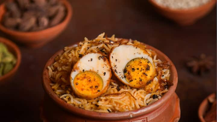 Spicy Anda Roast Biryani is unique because it combines hard-boiled eggs with a medley of flavorful spices and aromatic rice. The eggs are roasted and mixed with the rice, absorbing all the rich flavours. (Image source: Special Arrangements)