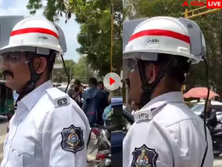 policemen in gujarat are doing duty wearing ac helmets video viral Ac In Helmet: ਮਾਰਕਿਟ 'ਚ ਆਇਆ AC ਹੈਲਮੇਟ,ਸਿਰ 'ਤੇ ਪਾ ਕੇ ਡਿਊਟੀ ਕਰਦੇ ਦੇਖੇ ਗਏ ਪੁਲਸ ਕਰਮਚਾਰੀ, ਦੇਖੋ ਵੀਡੀਓ