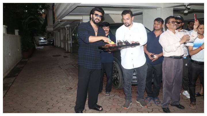 Actor Arjun Kapoor, who celebrated his 39th birthday on Wednesday, interacted with paparazzi and cut cake with them.