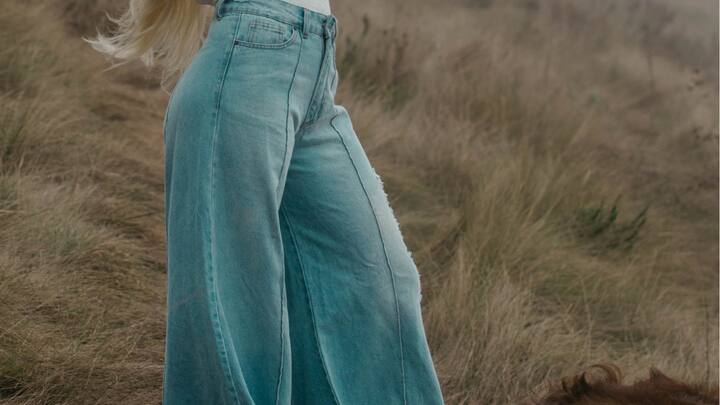 Wide-Leg Trousers: Wide-leg trousers offer freedom of movement and can be styled with sneakers for a casual look or heels for a more formal occasion. (Image source: Canva)
