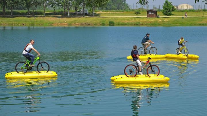 Water Cycling: A delightful blend of fitness and enjoyment on the water. This innovative activity allows one to pedal across the water's surface, offering a stable, eco-friendly activity that guarantees safety and stability. With its design ensuring virtually no risk of tipping over, water cycling provides a refreshing and exhilarating way to embrace the beauty of nature. Glide gracefully under the warm sun, relishing the unique sensation of cycling atop water—an experience that promises tranquility and thrill in equal measure. (Image source: Pinterest/ startupselfie.net)