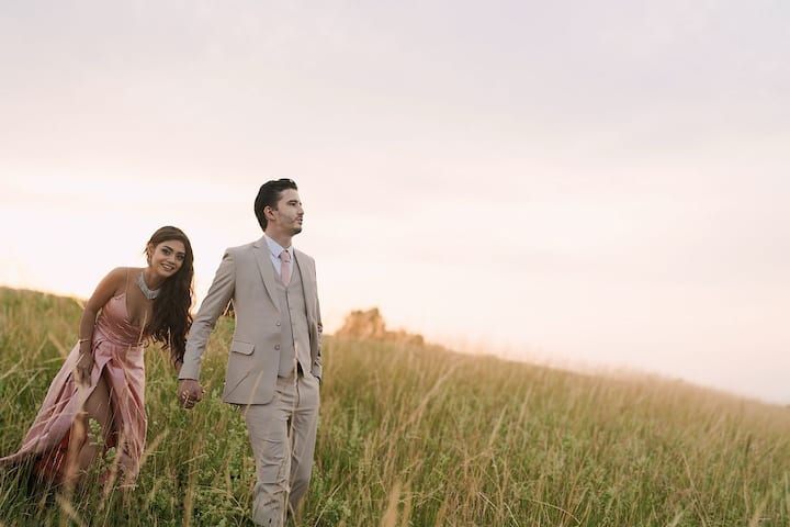 Sreejita can be seen wearing a blush pink dress with a high slit as she walks in the meadows with Michael.