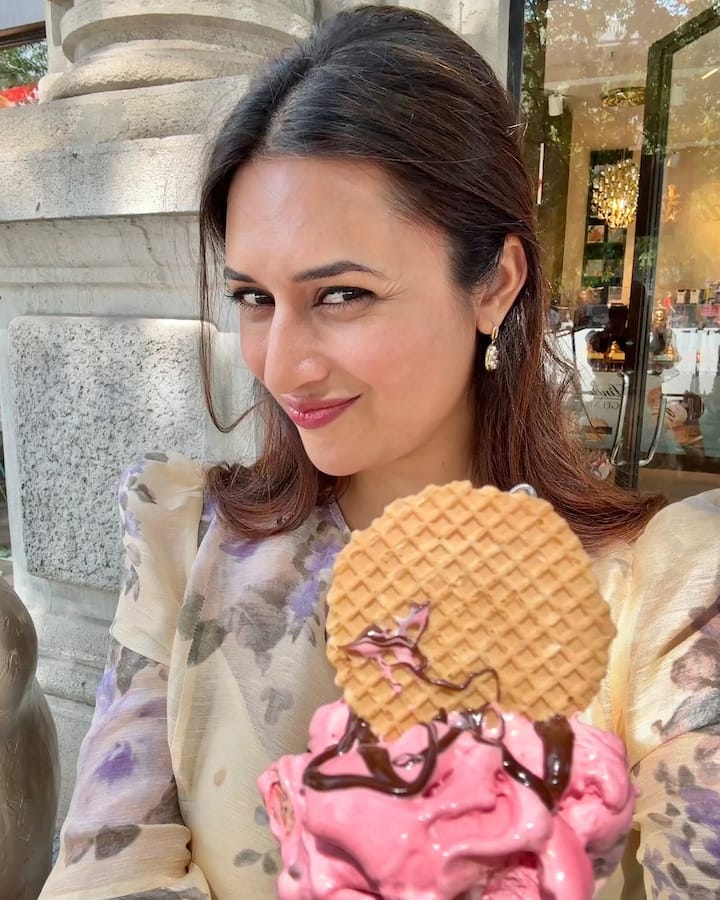 Divyanka also shared a picture and a Reel video from a gelato shop. In the snapshot, Divyanka is seen wearing an off-white floral dress and holding a gelato ice cream.