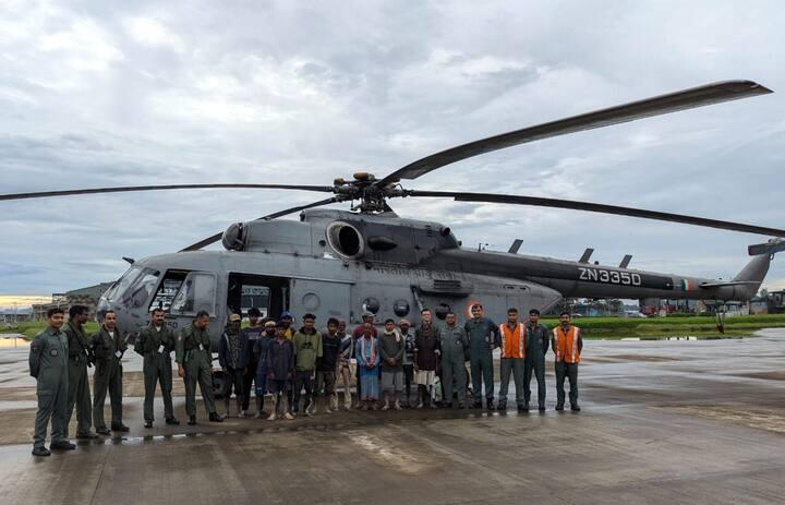 IAF rescued 13 marooned survivors from a small island in the flooded Brahmaputra, north of Dibrugarh in Assam, a Mi-17 IV helicopter from AFS Mohanbari flew in challenging weather conditions and undertook a rescue operation from a marshy piece of land. (Image Source: PTI)