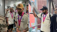 Photos: चैंपियन बनकर वतन लौटी टीम इंडिया, रोहित शर्मा के हाथ में नज़र आई चमचमाती ट्रॉफी; देखें तस्वीरें