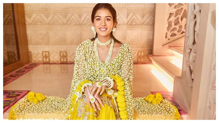 Pictures of Radhika Merchant's look from her Haldi ceremony are out. She looked stunning in a head-to-toe yellow outfit.