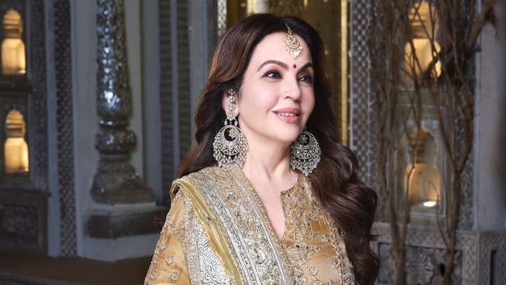 Nita Ambani looked astounding at the haldi ceremony in a gorgeous golden outfit with silver chatai technique embroidery.