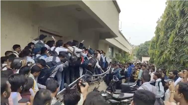 Stampede-Like Situation In Gujarat Ankleshwar Job Seekers fall of railing Thermax chemicals Stampede-Like Situation As Hundreds Of Job Seekers Clamour Outside Gujarat Hotel — WATCH