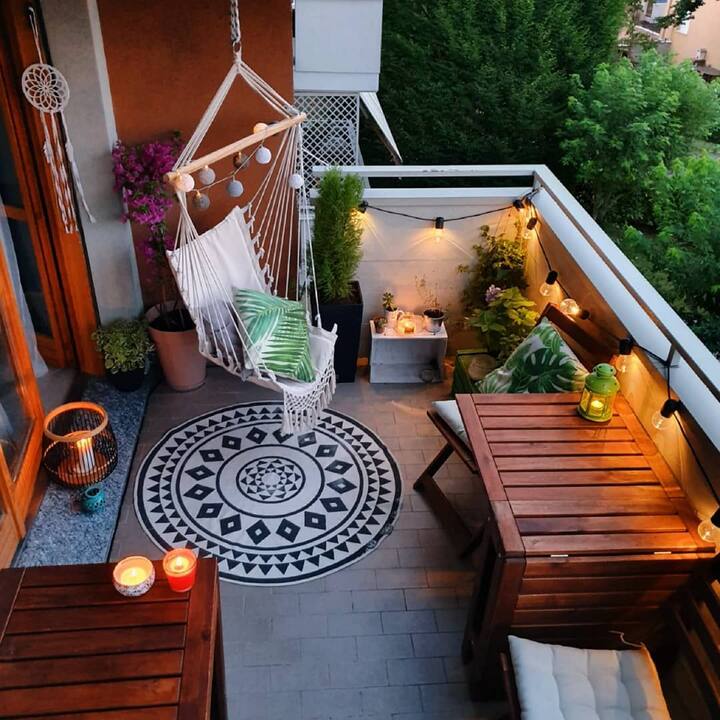 You should light up the balcony. For this, you can use lamps, candles or even solar lights.