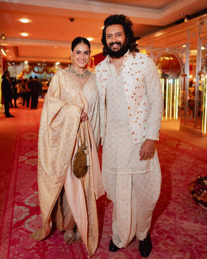 Riteish Deshmukh and Genelia Deshmukh compliment each other as they pose happily inside the venue.