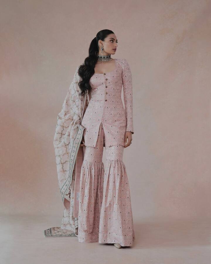 Her outfit was a combination of sharara, a fitted kurta and a matching dupatta.