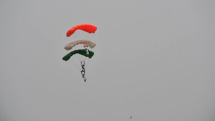 A spectacular air show was organised, featuring displays by the Akash Ganga Team and aerial performances by Jaguar, Su-30 MKI, and Rafale fighter aircraft. In this photo, Akashganga Skydiving Team of the IAF in action during the event.