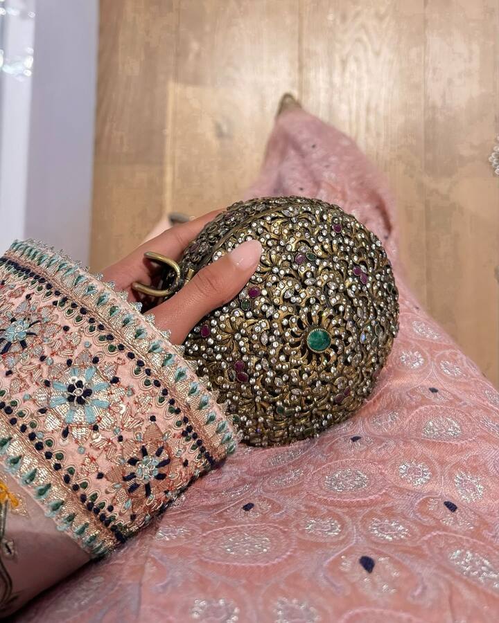 She was also carrying a Kundan embroidered golden clutch.