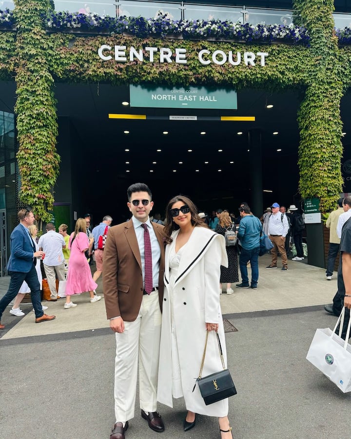 Parineeti wore a white dress paired with a white coat.