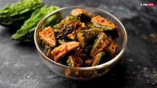 Karele Ka Achar: कम समय में घर पर तैयार करें ये टेस्टी करेले का अचार, सेहत के लिए भी है फायदेमंद