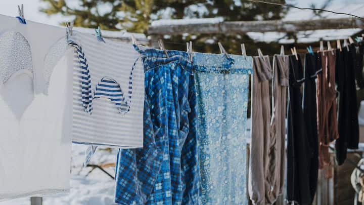 Drying: Never hang your wet Chikankari or handpainted clothes in direct sunlight. Strong UV rays can cause fading and weaken the fabric. Instead, spread them out on a clean, dry towel in a well-ventilated area. (Image source: Canva)