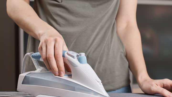 Ironing: Refrain from ironing wet Chikankari or handpainted clothes. Always wait for them to dry completely before ironing. Use a low heat setting and place a clean cloth between the iron and the garment to protect the delicate work. (Image source: Canva)