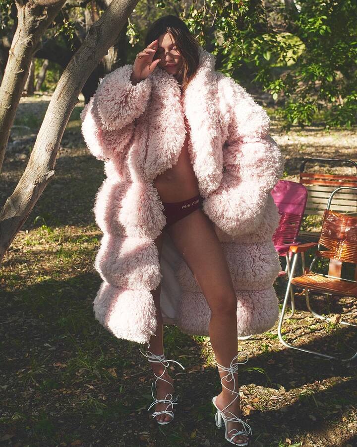 The Rhode founder appears wearing chic baby bump-baring outfits, including appealing lingerie.