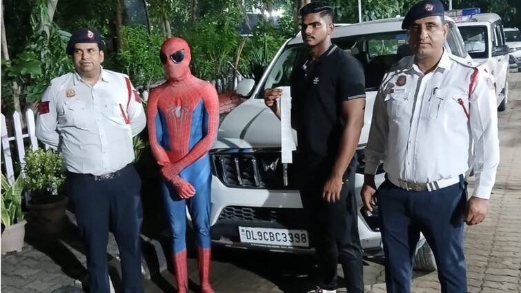 Delhi Traffic Police man dressed spiderman riding car bonnet dangerous driving dwarka Spiderman In Legal Trouble: Man Dressed As Superhero Arrested By Delhi Traffic Police For Riding On Car Bonnet