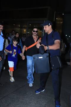 लंदन में वेकेशन एंजॉय करने के बात पत्नी गौरी और बेटे अबराम संग मुंबई लौटे SRK, रफ एंड टफ लुक में फैमिली संग छाए 'पठान'